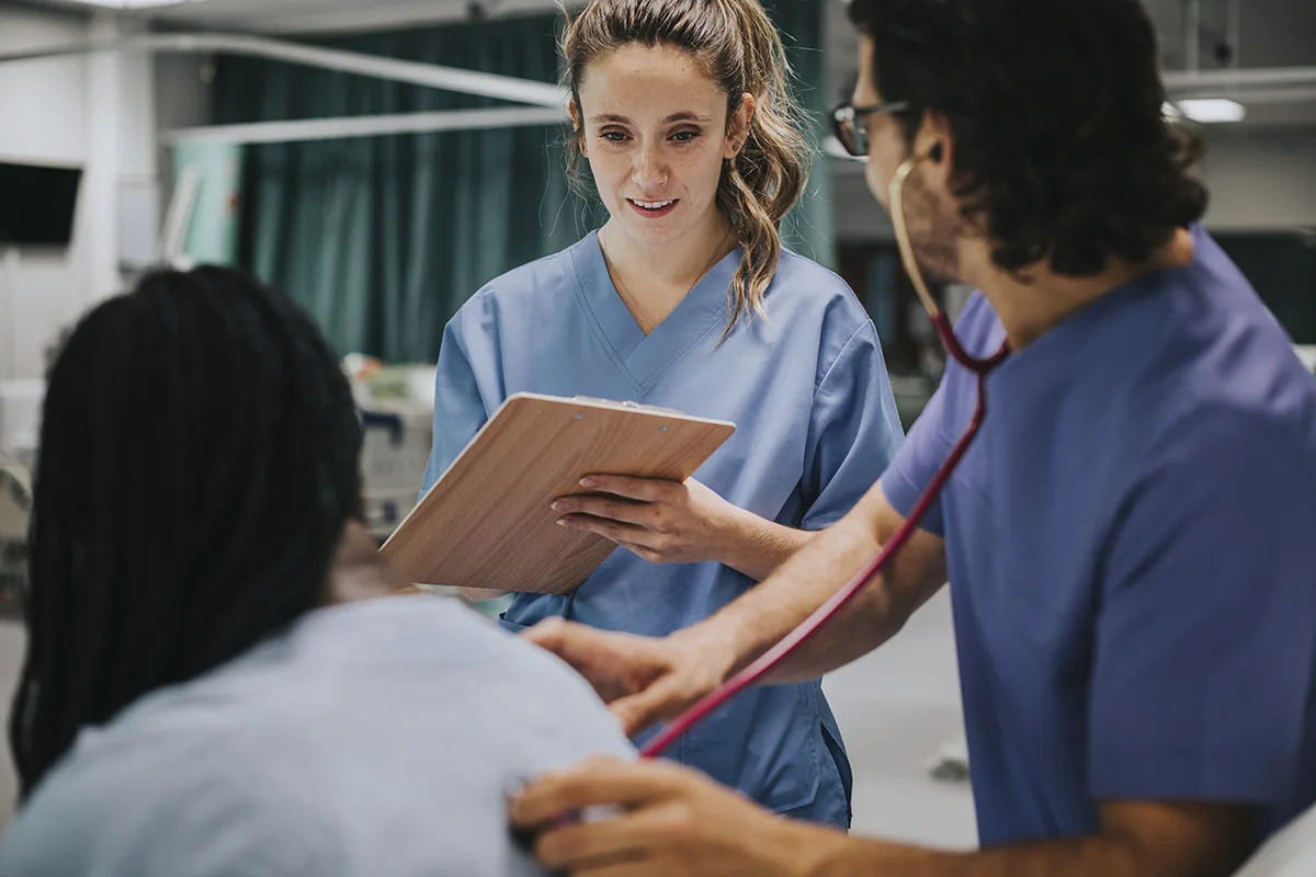 A medical student speaking to a patient